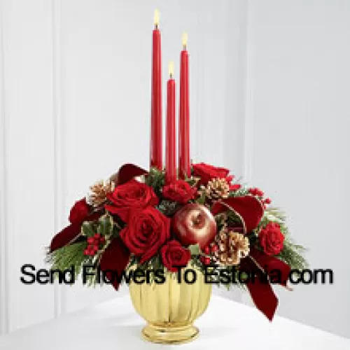 The grandeur and rich beauty of the Christmas season are highlighted with each crimson bloom. Bright red roses and spray roses are arranged in a designer gold container amongst variegated holly and assorted holiday greens. Accented with artificial apples, gold pinecones and gold-edged burgundy ribbon, this gorgeous centerpiece displays three red taper candles to create the perfect atmosphere for their holiday celebration.  (Please Note That We Reserve The Right To Substitute Any Product With A Suitable Product Of Equal Value In Case Of Non-Availability Of A Certain Product)